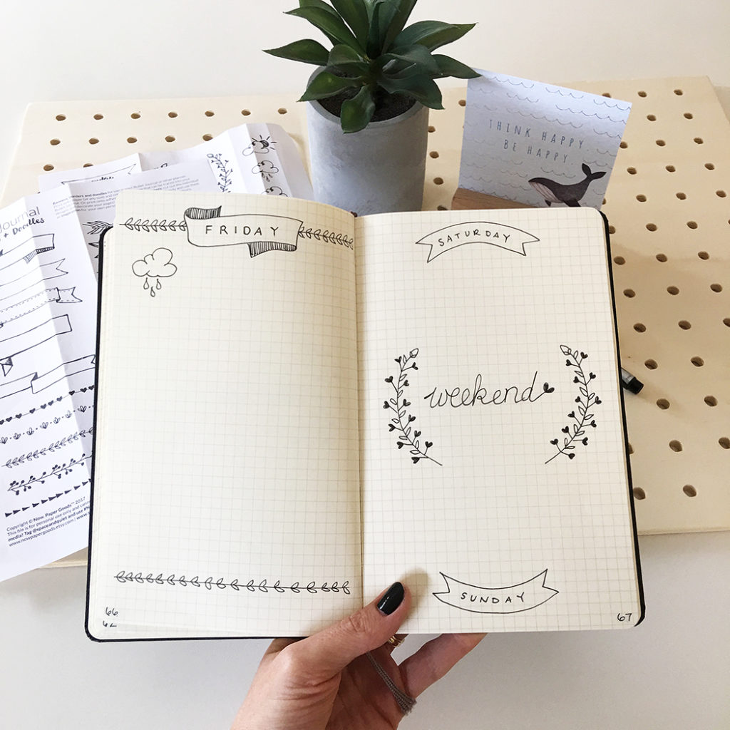 Bullet journal pages with hand drawn decorations and lettering