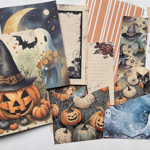 Assorted journal pages and ephemera printed out from the Halloween Junk Journal Kit