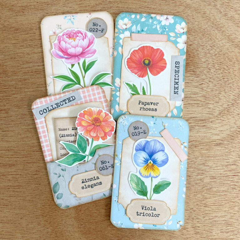 4 flower specimen cards assembled by hand using pieces from the printable kit