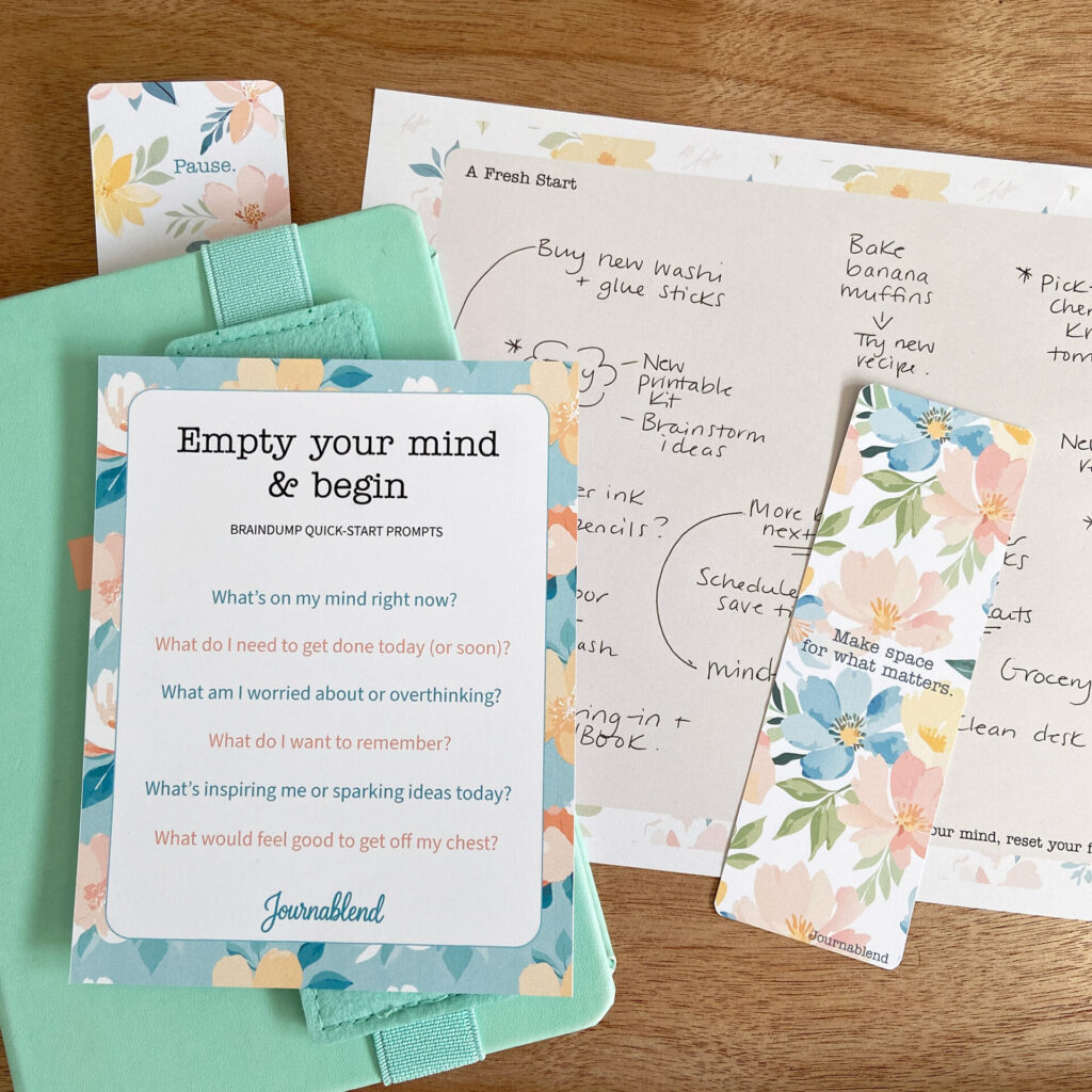 My notebook with a filled-in braindump page, bookmarks and Braindump Quick-Start Prompts card