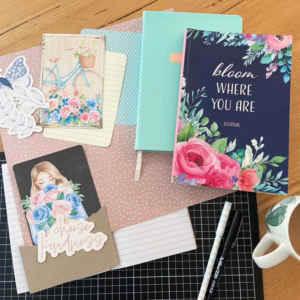 Notebooks, Journals and BlendBooks on desk with papercraft supplies
