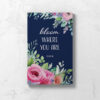 Perimenopause Journal showing front cover that is dark blue, with a floral design and the words Bloom Where You Are.
