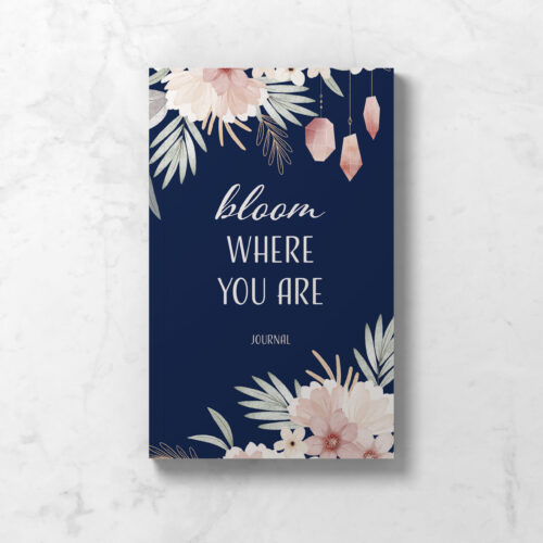 Perimenopause journal showing front cover in navy blue with crystals and flowers, and the words Bloom Where You Are.