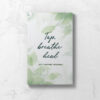 Front cover of EFT Tapping Journal featuring soft watercolor leaves and the wording Tap, breathe, heal.