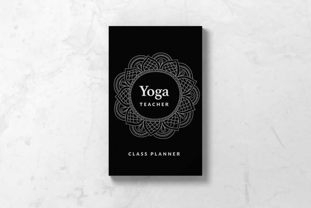 Yoga Teacher Class Planner Notebook featuring a black cover with mandala inspired design.