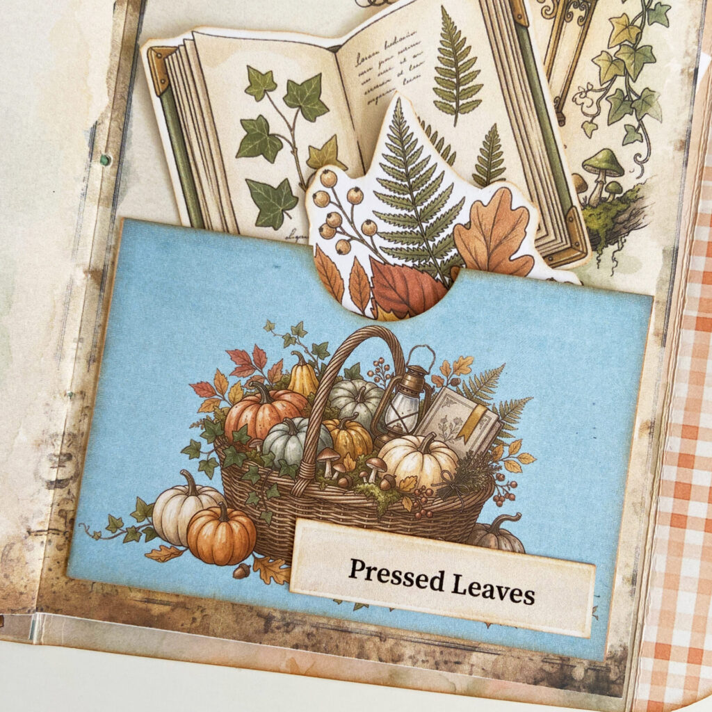 Pressed Leaves word strip adorning a blue pocket filled with autumn fussy cuts.