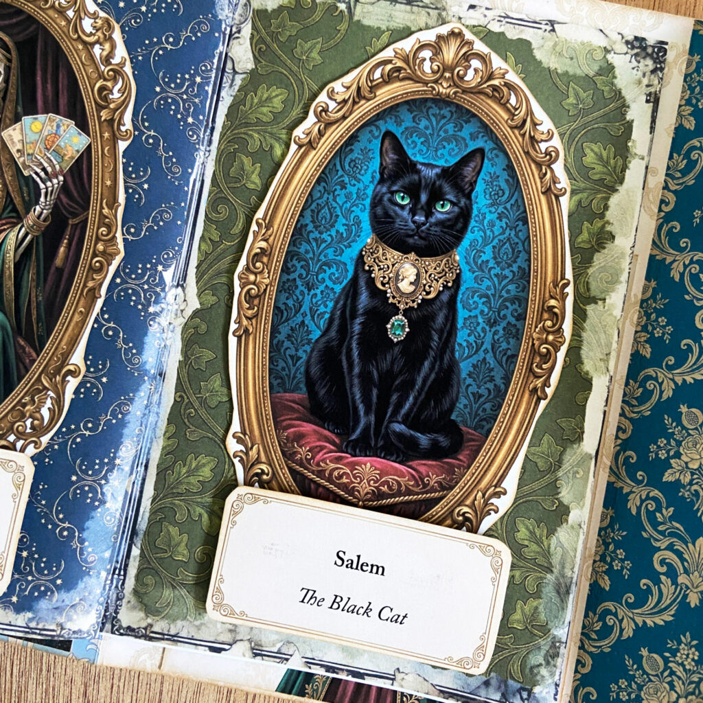 Page inside a Victorian Gothic Halloween Junk Journal featuring a framed portrait of Salem The Black Cat, from Blackwood Manor