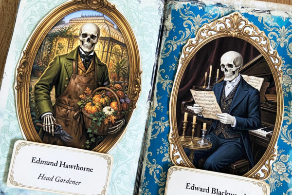 A double page spread inside a Victorian gothic halloween folio junk journal, featuring pages with Victorian aged patterns, and Skeleton family antique portraits.