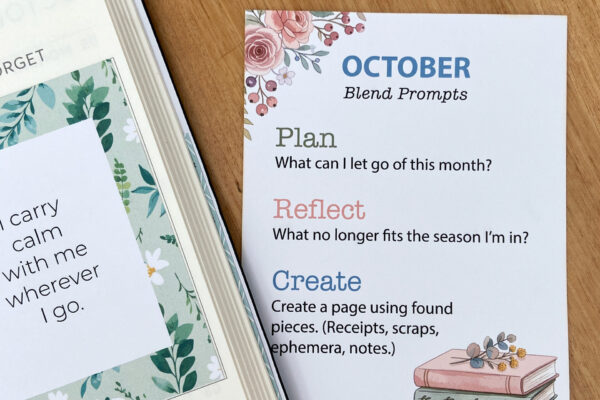 October Blend Prompt card on desk beside dated planner, featuring 3 October journaling prompts